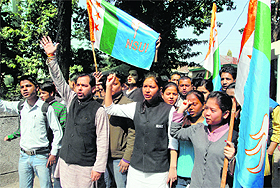 NSUI workers stage a demonstration against the bomb blast at Maharana Pratap Sports College in front of the District Magistrates office in Dehradun on Thursday.
