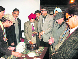 Members of Rotary Club cut a cake in Mussoorie on Thursday