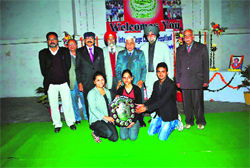 Students of SD College, Ambala Cantonment, and faculty members pose for a photograph after winning the Professor Rajeshwar Prasad Shokh Memorial Running Trophy at Shahabad Markanda in Kurukshetra.
