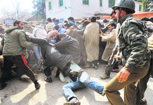 Policemen lathi-charge protesting Public Health Engineering employees in Srinagar on Thursday