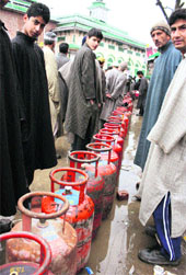 Locals queue up for cooking gas in Srinagar. The Valley has been facing acute LPG shortage this winter due to closure of the national highway as a result of heavy snow and rain in the region. 