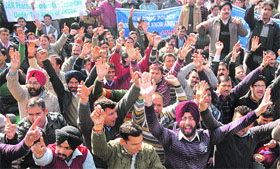 Members of the J&K Pharma Coordination Committee protest against the new drug policy announced by the state government in Jammu on Thursday.
