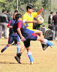 Players of IRP 14 and IRP 17 vie for the ball during an Inter-Battalion Sports Tournament-2012 at Gulshan Ground in Jammu on Thursday. 