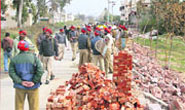 Heavy police posse deployed near the demolished wall of DAV College girls hostel