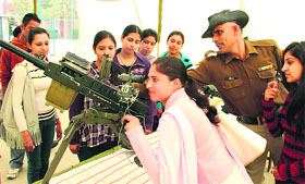 A student gets tips to operate a weapon at Techknack-2012 in Jalandhar on Thursday