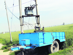 A transformer installed on a tractor trailer at a village near Jagraon.