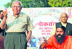Yoga guru Ramdev with lawyer Ram Jethmalani in New Delhi on Thursday