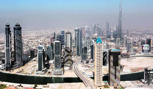 Dubai skyscrapers with the Burj Khalifa, the worlds tallest tower at 828 metres (2,717 ft), seen in the background. The Dubai International Financial Center expects to permit transactions in the Chinese yuan from this year. The change would represent an important step in Chinas drive to encourage international use of its currency, since the UAE is one of the worlds top five oil exporters and the second largest Arab economy in the Gulf. 