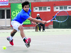 Sanam returns a shot during the semi-final match of the ITF Mens Tournament at the CLTA.