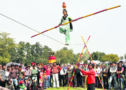 A girl shows her skills on the rope at the 40th Rose Festival-2012 at Zakir Rose Garden, Sector 16, Chandigarh, on Friday. 