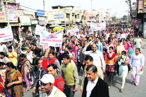 Representatives of private schools take out a protest march against Rule 134 A in Rohtak on Friday.
