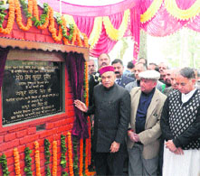 Chief Minister PK Dhumal lays the foundation stone of the Integrated Housing and Slum Development Programme at Sundernagar on Friday. 