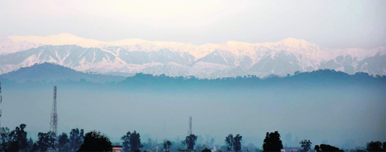 A panoramic view of the snow-capped Trikuta Hills captured from Hiranagar in Jammu. Tribune photo: Anand Sharma