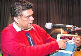 The SDM-II, Rajiv Prashar, demonstrates the opening of an electronic voting machine to the staff during a counting rehearsal in Jalandhar on Friday. 