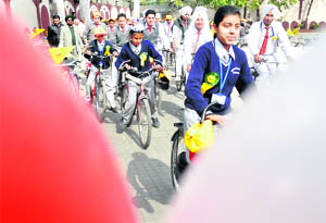 Students take out an “Avon green bicycle” rally in Ludhiana.
