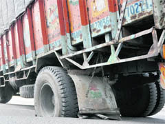 A truck carrying plywood got stuck on a road near the ESI Hospital for hours following a cave-in. 