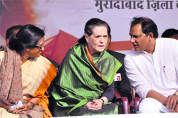 Congress president Sonia Gandhi with UPCC chief Rita Bahuguna and party MP Mohd Azharuddin in Moradabad on Friday.  PTI