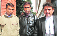 Kamal Chauhans uncle Vishnu Chauhan and friend Kismat Chauhan at a Panchkula court 