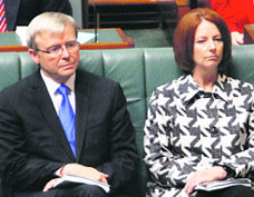A file photo of former Australian PM Kevin Rudd (L) seated next to PM (then Deputy PM) Julia Gillard at Parliament House in Canberra.