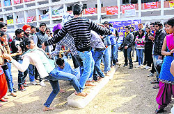 Students take part in a fun game during “Cyanide 2012” at Panjab University in Chandigarh on Saturday