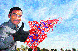 Ujjal Shah from Ahmedabad shows his skill by flying 105 kites during the second day of the Rose Festival in Chandigarh on Saturday