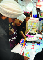 Visitiors at a stall at the book fair in New Delhi,