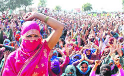 Women protesters shout pro-reservation slogans at Ramayan village of Hisar district
