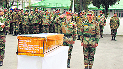 Lt Gen KT Parnaik, GOC-in-C, Northern Command, pays homage to one of the soldiers killed in a recent avalanche, in Srinagar on Saturday. 