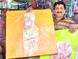A book store owner shows samples of science models in Jalandhar on Saturday.
