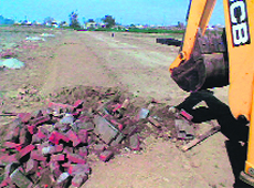 A road being dug up in an unauthorised colony near Gill village on Saturday. 