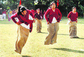 Girls take part in a sack race at Partap college in Ludhiana. 