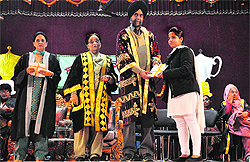 A student being honoured during the annual prize distribution function at Government College for Women in Ludhiana on Saturday