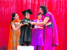 A student being honoured at Penguin Castle Playway in Ludhiana. 