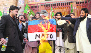 Activists of Pakistan Muslim League burn an effigy representing NATO in Quetta. 