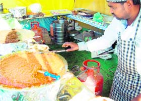 Domestic LPG cylinder can be seen being used at a stall during a shopping festival in Amritsar on Sunday