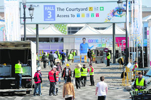 Workers unload trucks during preparations for the 2012 Mobile World Congress in Barcelona on Sunday.