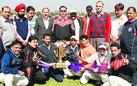 The winners of Proflex Cup League Cricket Tournament with the trophy at Cricket Stadium, Sector 3, Panchkula, on Sunday. Tribune photo: Nitin Mittal