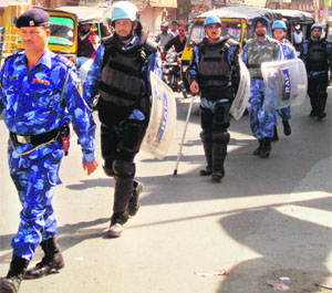 Rapid Action Force personnel stage a flag march in Hisar on Sunday. 
