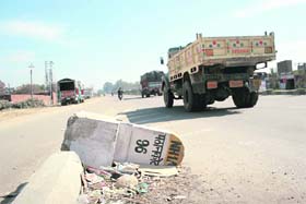 A damaged milestone at Kaluchak Road