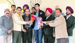 Pranav Chopra being honoured by the Ludhiana Badminton Academy on Saturday. 