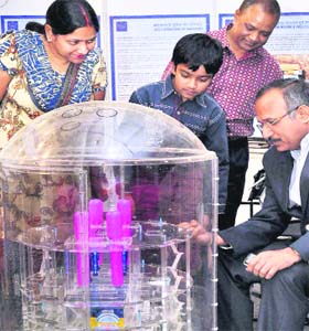 Visitors admire prototype of a nuclear reactor at the Jharkhand International Trade Fair in Ranchi on Sunday