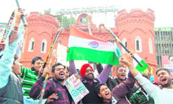 Hockey fans in Amritsar celebrate the victory of Indian hockey team over France in the final of Olympic qualifiers 