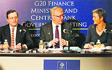 European Central Bank president Mario Draghi (L), EU Economic & Monetary Affairs Commissioner Olli Rehn and Danish Economy Minister Margrethe Vestager (R) at a news conference as part of the meeting of the Group of Twenty (G20) leading economies' finance ministers and central bankers in Mexico City on Sunday. 