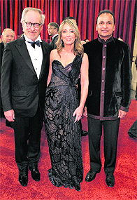 Industrialist Anil Ambani (R) walks the red carpet with his DreamWorks Studios partners Steven Spielberg (L) and Stacey Snider at the Academy Awards in Hollywood, California on Sunday. Ambani's Reliance Entertainment holds a 51% stake in DreamWorks
