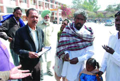 A member of the health team issuing a challan to a person caught smoking on the premises of the Civil Hospital in Bathinda 