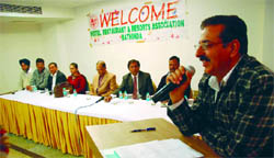 Satish Arora, president of the City Hotel and Restaurant Association, addresses a gathering at the meeting with the officials of the Income Tax department in Bathinda 