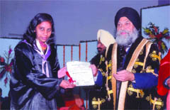 Ritu Singla receives a medal and certificate from Sardar Jaspal Singh, vice-chancellor of Punjabi University at the convocation ceremony