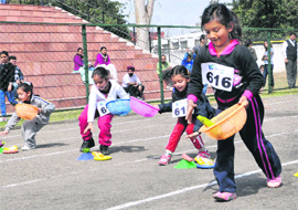 Children take part in a fun race during the annual sports day of The Millennium School, Mohali,at Sports Complex, Sector 7, Chandigarh, 
