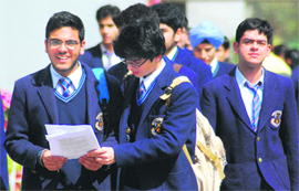 Class X students discuss the question paper after appearing in an ICSE examination at St Kabir School, Sector 26, Chandigarh, on Monday. 