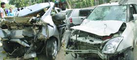 The mangled Honda City and Swift Dzire cars at a police station in New Delhi on Monday